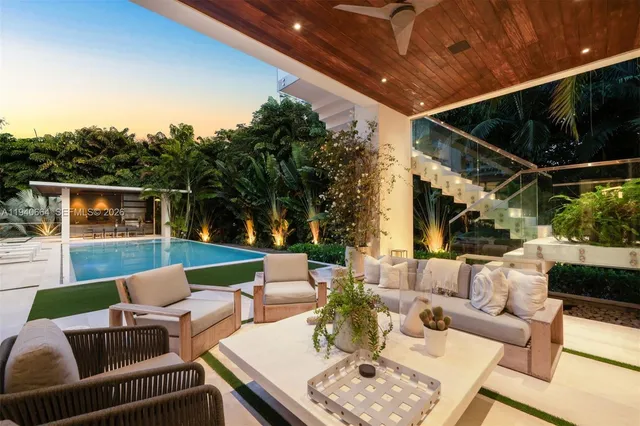 a patio with patio a couch and chairs