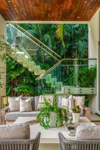 a view of a patio with couches table and chairs