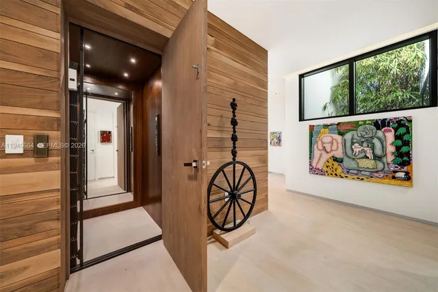 a view of an entryway with wooden floor