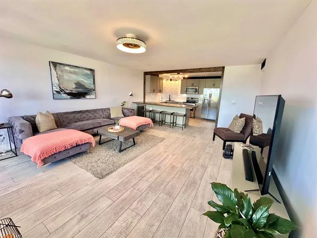 a stove top oven sitting inside of a kitchen