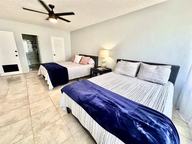 a bed room with a bed and a couch