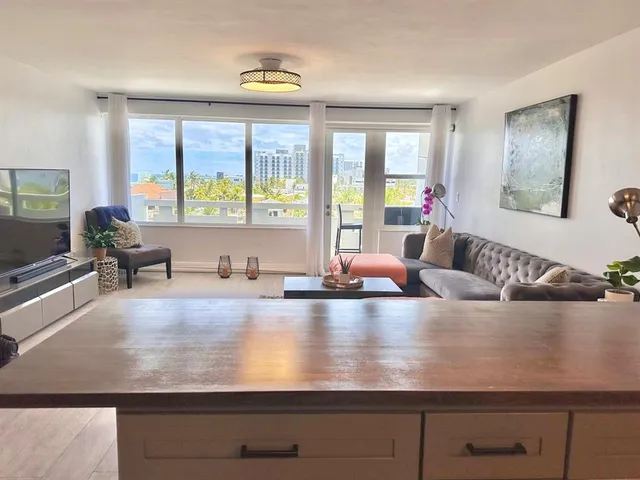 a view of a chairs and table in a balcony