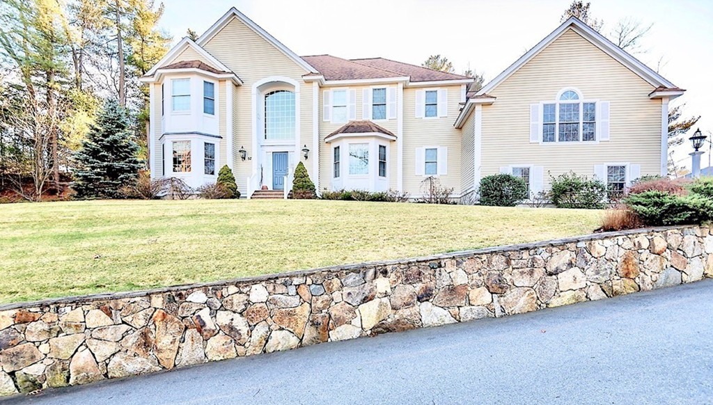 52 Chandler Circle Andover, MA 01810 - Photo 1 of 1 a front view of a house with a yard