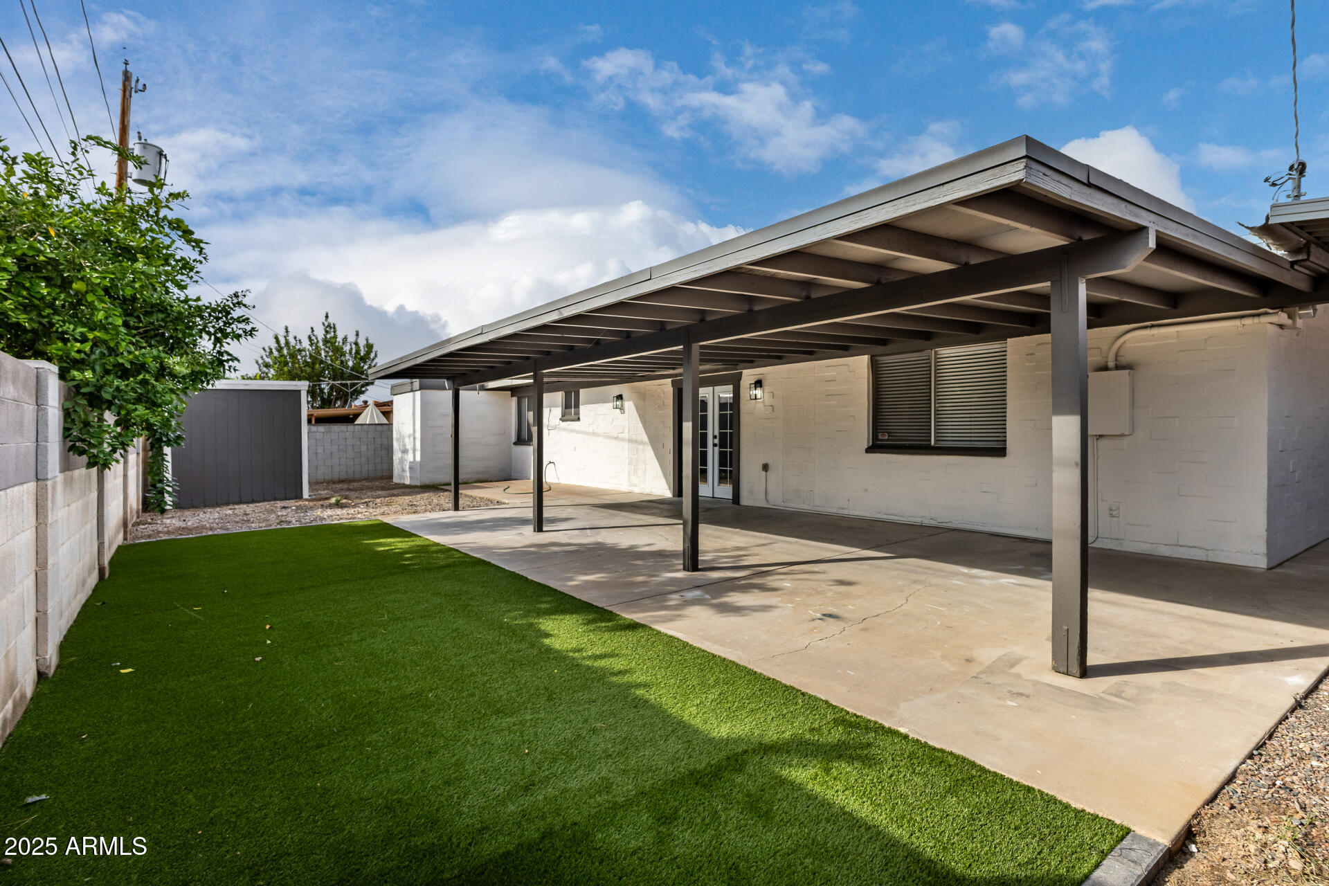 3619 West Griswold Road Phoenix, AZ 85051 - Photo 32 of 36 a front view of a house with garden