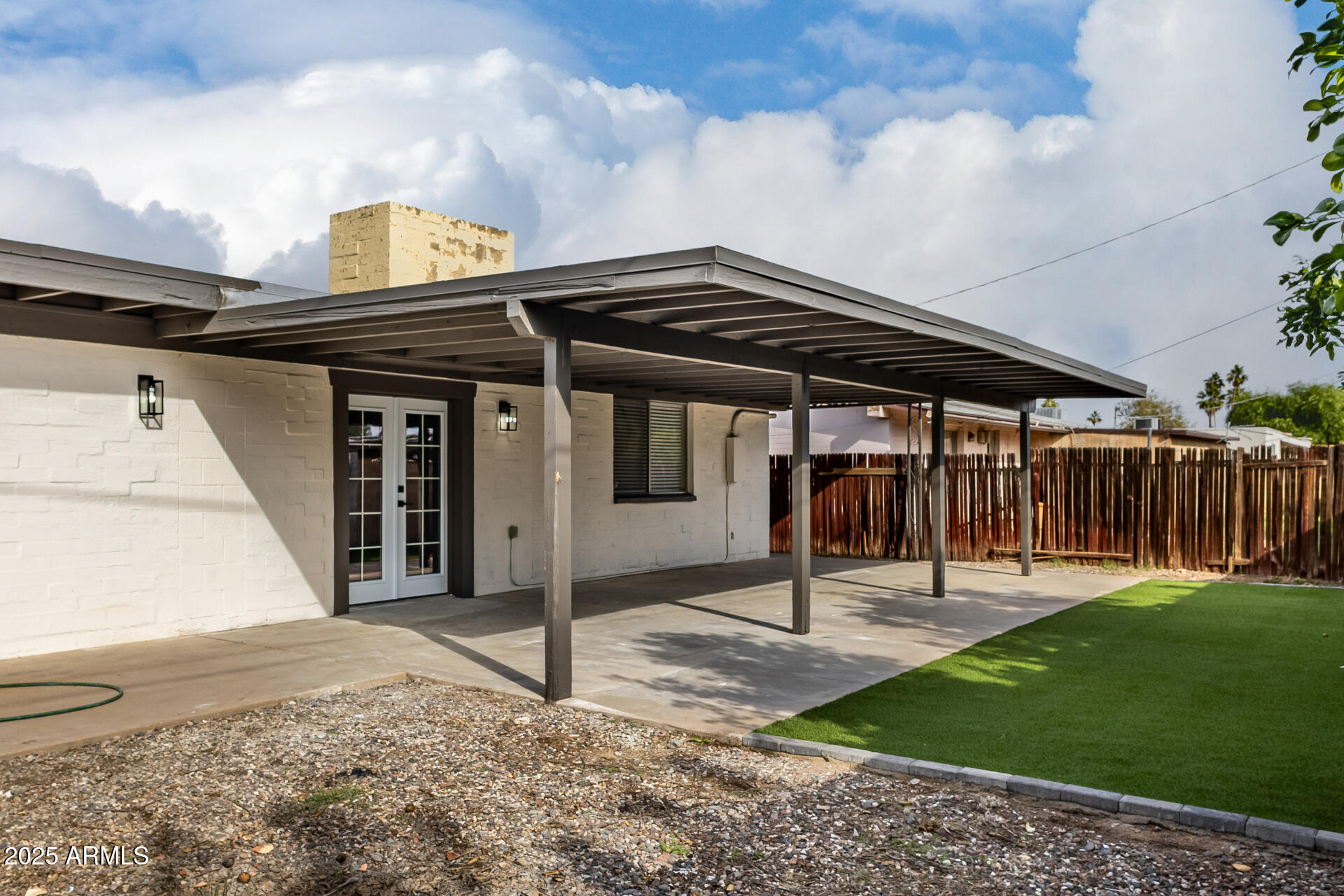 3619 West Griswold Road Phoenix, AZ 85051 - Photo 34 of 36 a front view of a house with a garden