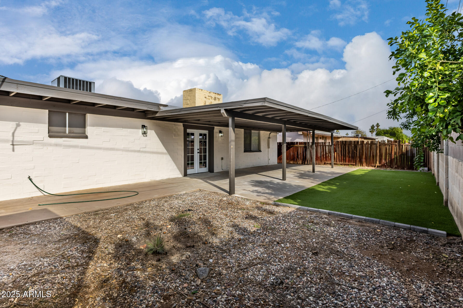 3619 West Griswold Road Phoenix, AZ 85051 - Photo 35 of 36 a front view of a house with garden