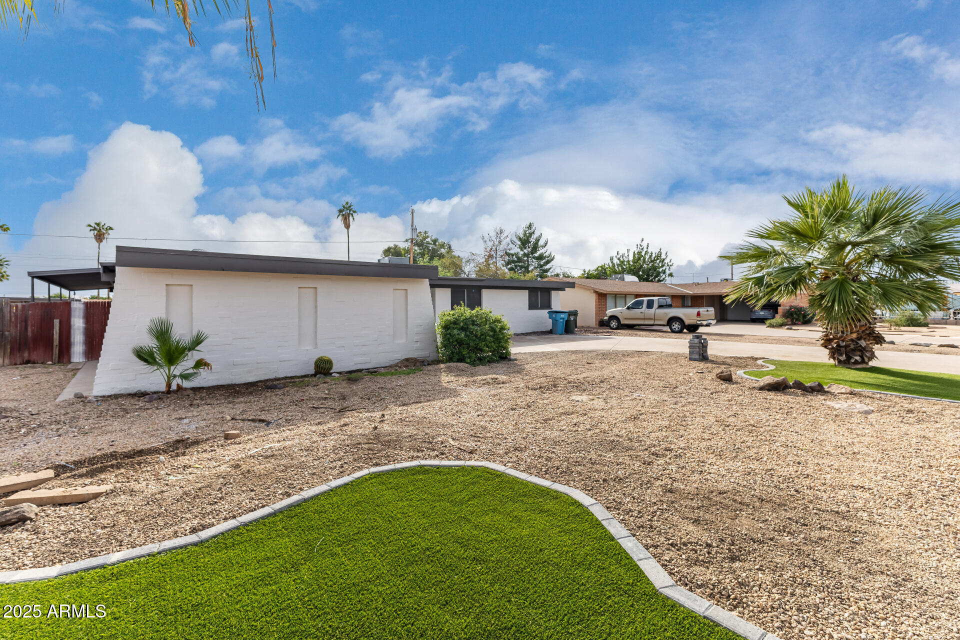 3619 West Griswold Road Phoenix, AZ 85051 - Photo 4 of 36 a view of a backyard with plants and a patio