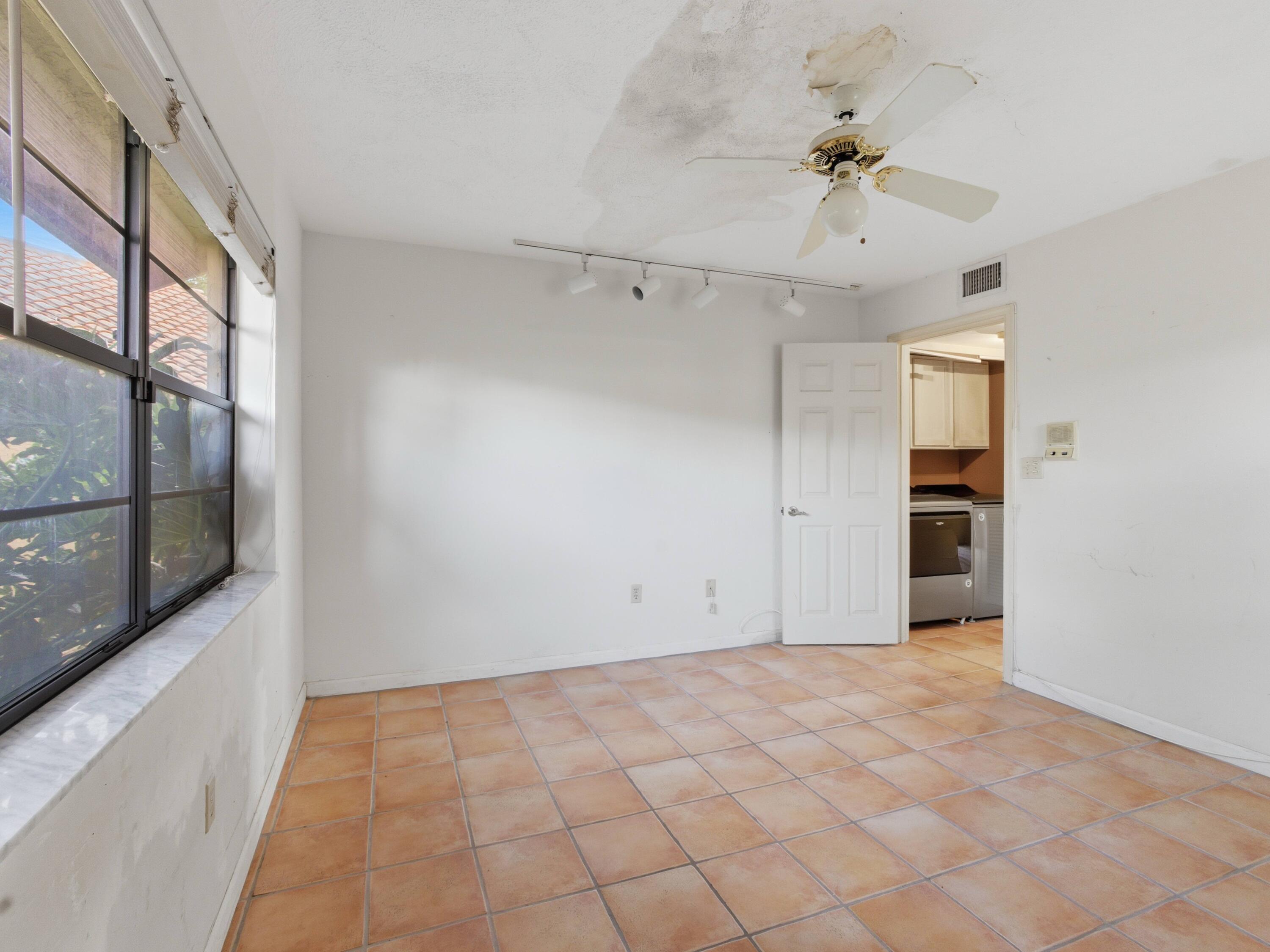 22511 Meridiana Drive Boca Raton, FL 33433 - Photo 15 of 40 a view of an empty room with a window