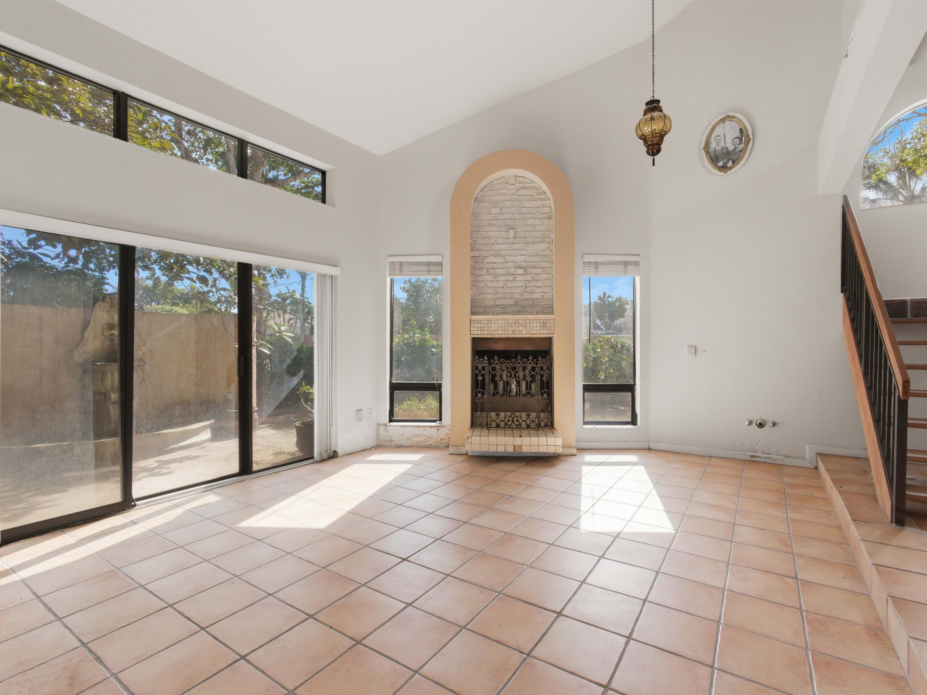 22511 Meridiana Drive Boca Raton, FL 33433 - Photo 19 of 40 a view of an empty room with glass door