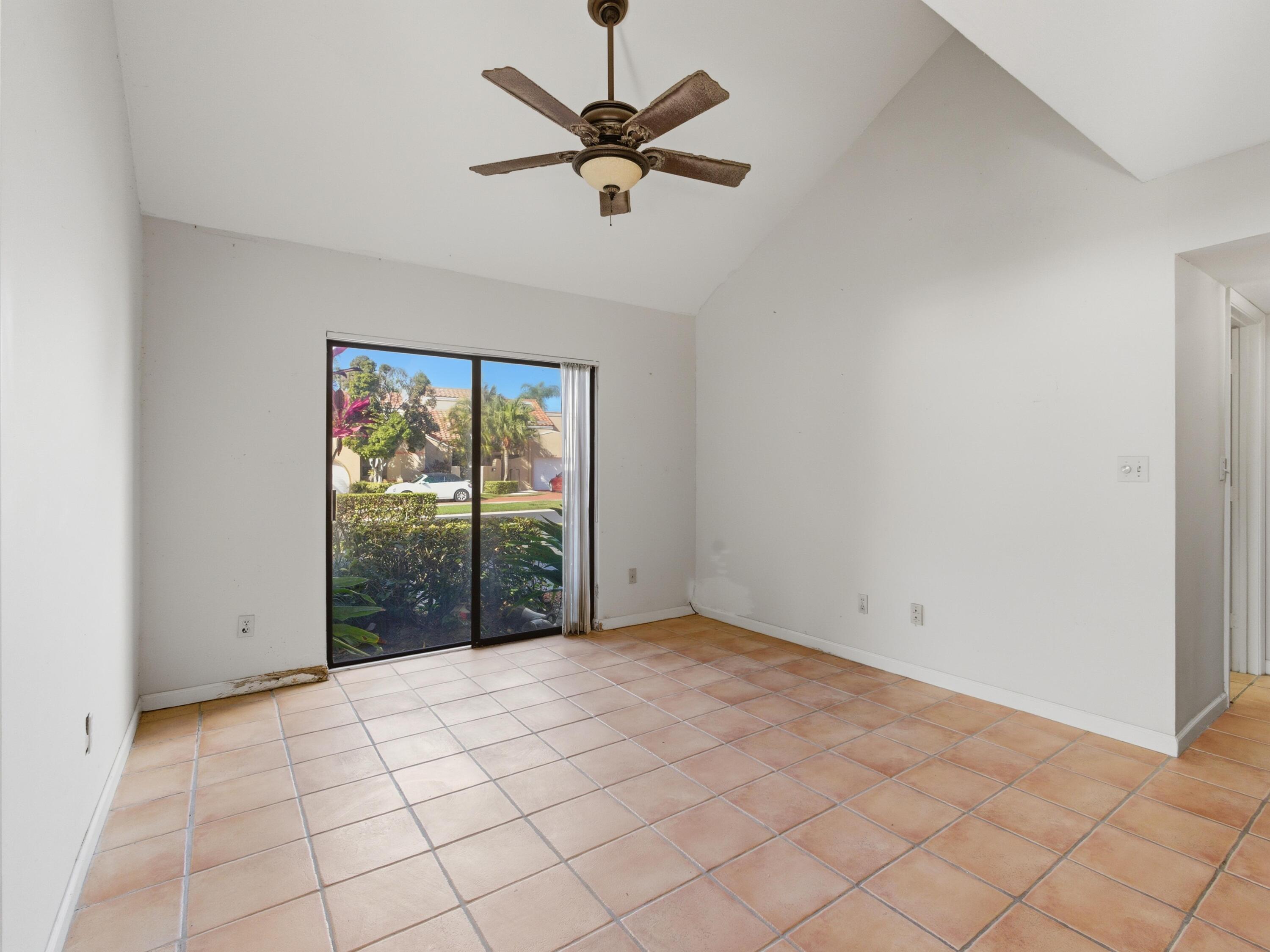 22511 Meridiana Drive Boca Raton, FL 33433 - Photo 3 of 40 a view of an empty room with a window