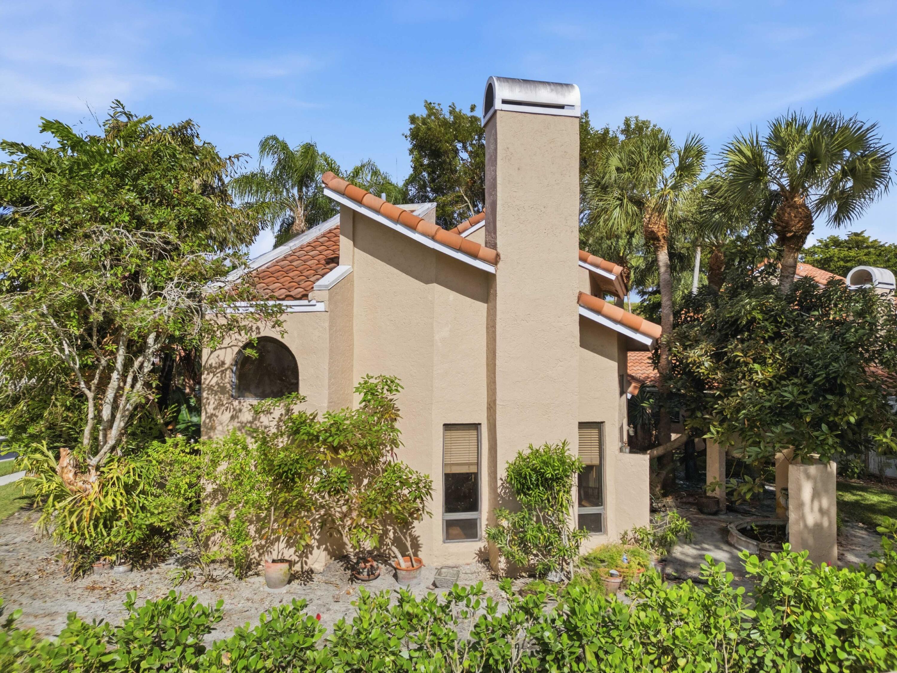 22511 Meridiana Drive Boca Raton, FL 33433 - Photo 30 of 40 a view of a house with a yard and tree s