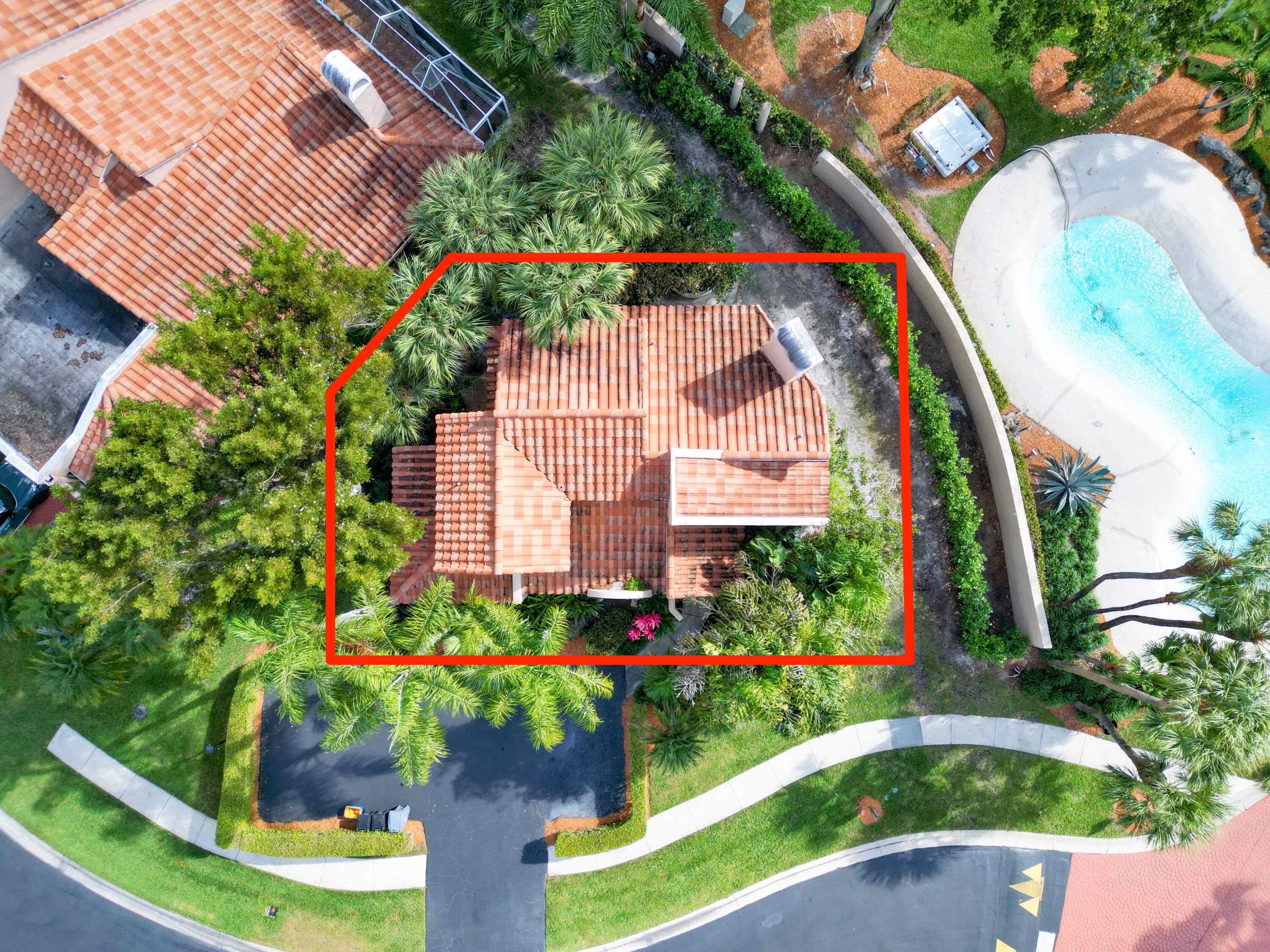 22511 Meridiana Drive Boca Raton, FL 33433 - Photo 5 of 40 a view of a house with a flower garden