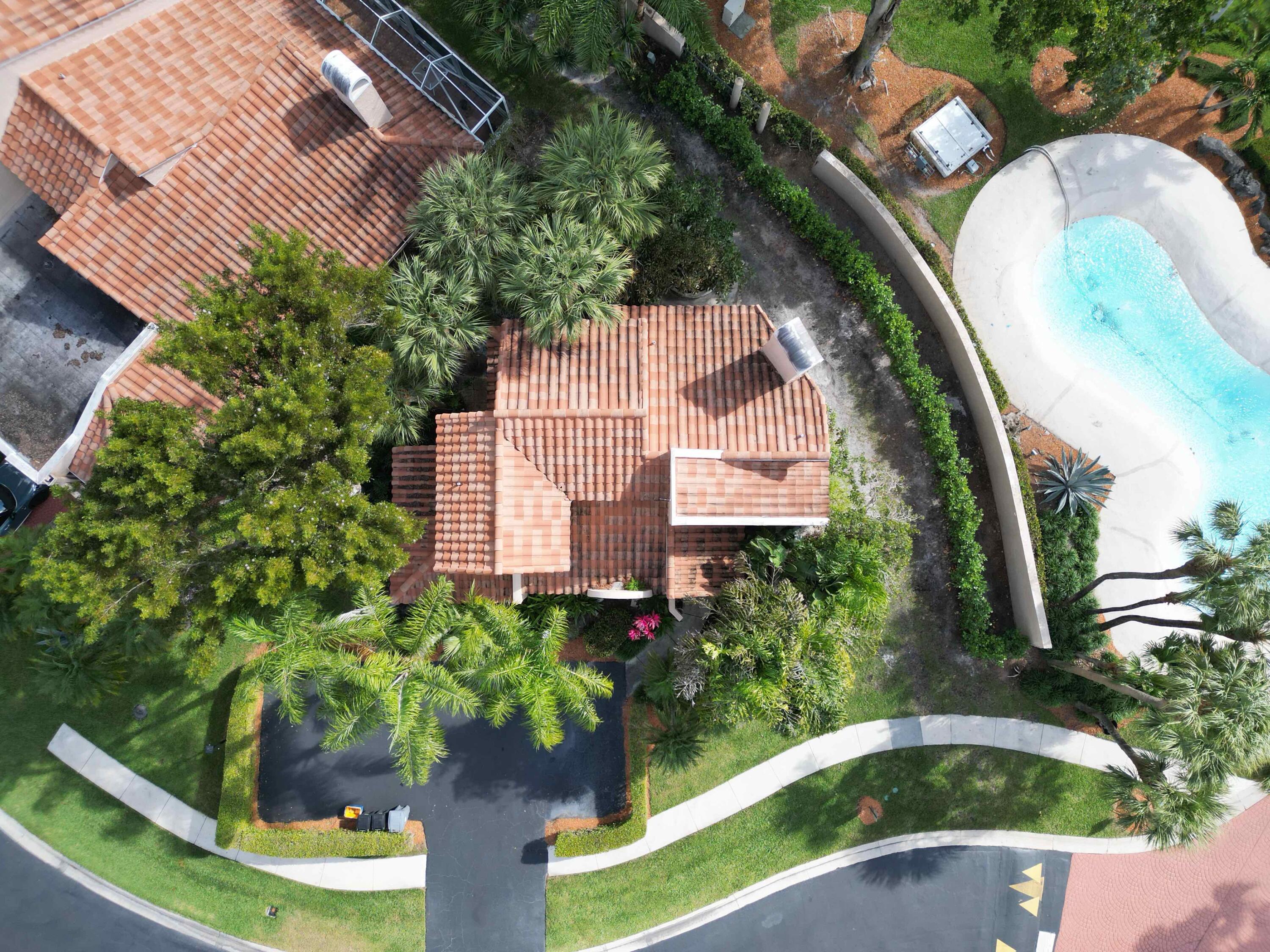 22511 Meridiana Drive Boca Raton, FL 33433 - Photo 6 of 40 a view of a garden with a fountain