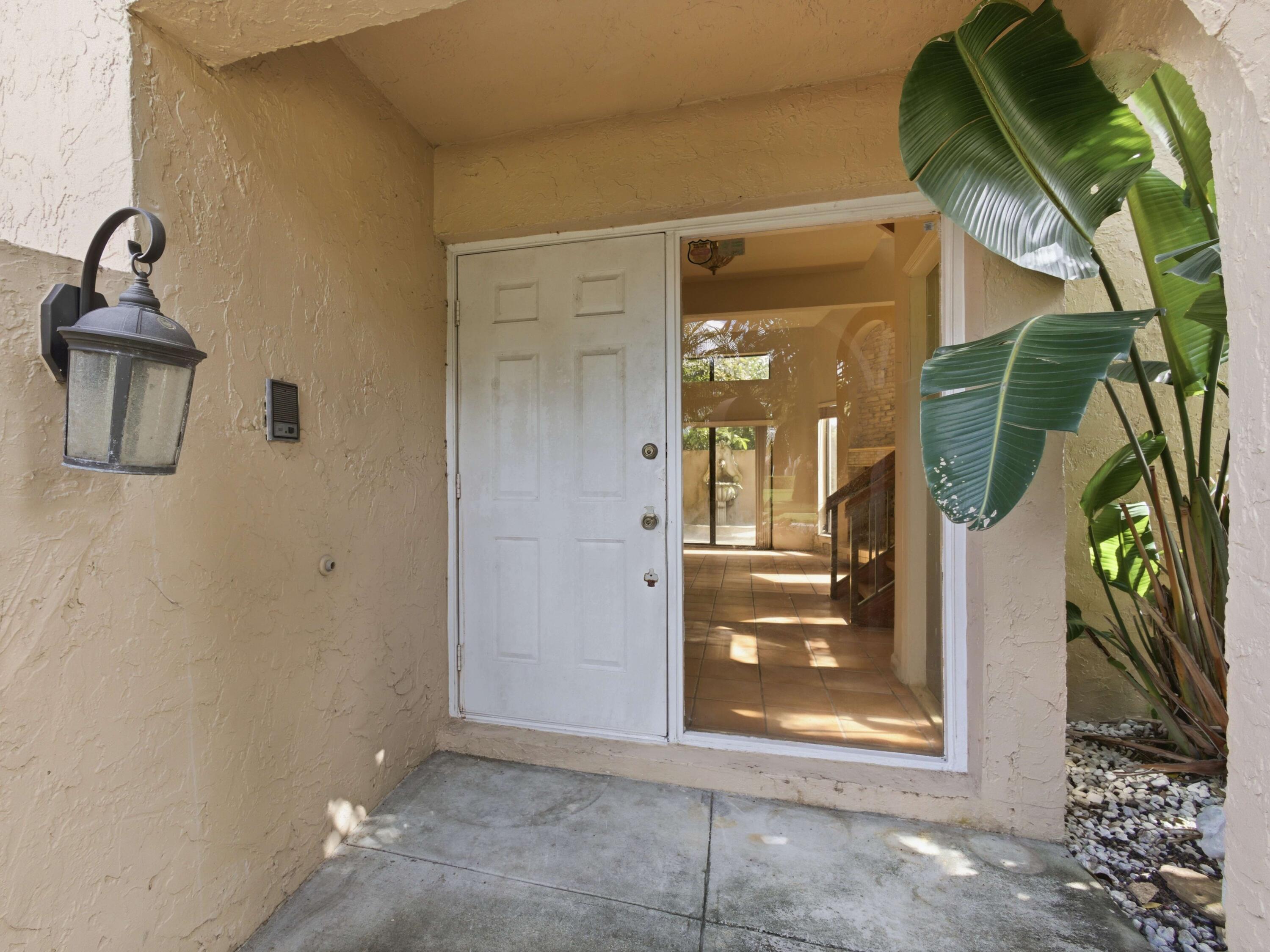 22511 Meridiana Drive Boca Raton, FL 33433 - Photo 9 of 40 a view of a entryway door front of house