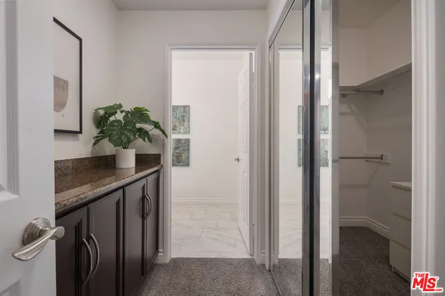 a view of a hallway and interior of the house