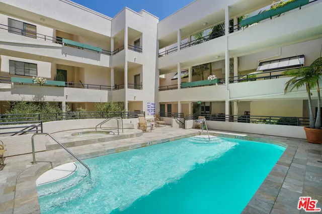 a view of a building with a garden area