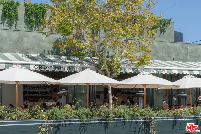 a view of a balcony with chairs
