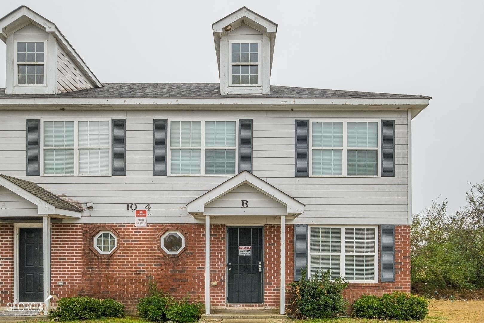 1034 Wheel House Lane, Unit B Monroe, GA 30655 - Photo 1 of 1 a front view of a house with a outdoor space