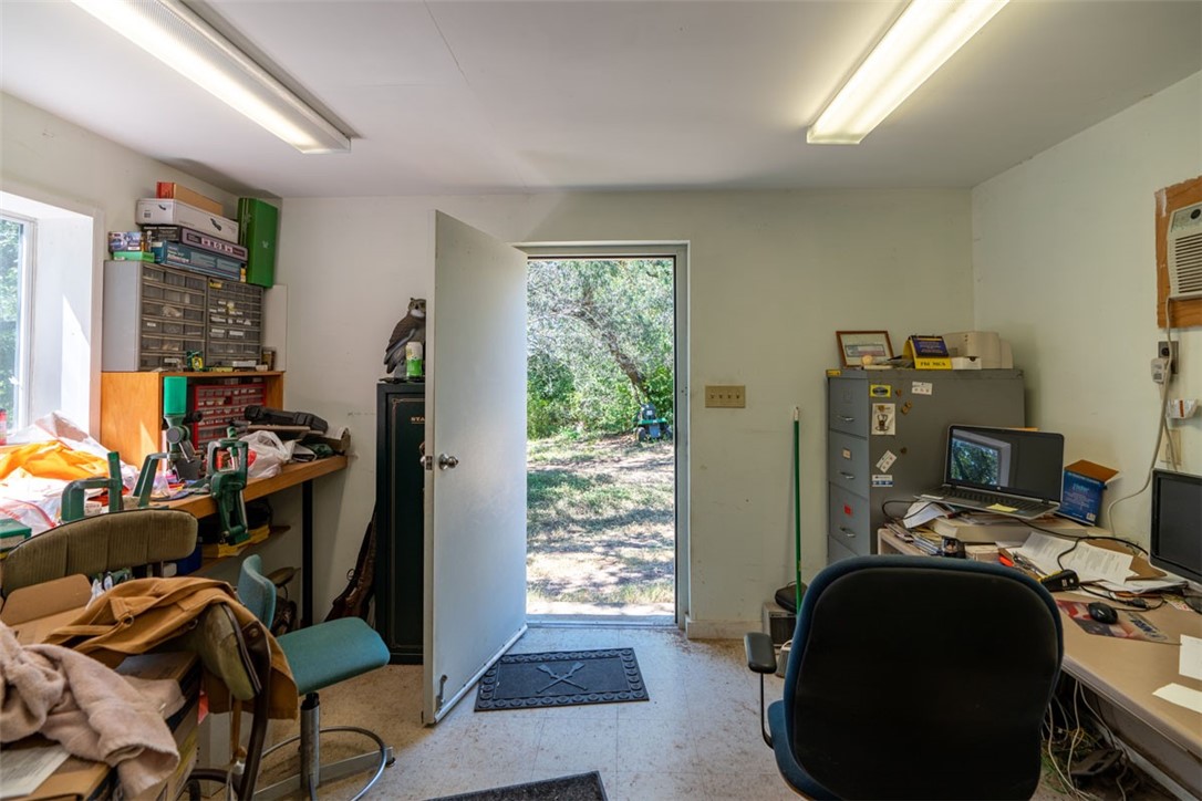 8701 Highway 290 Austin, TX 78737 - Photo 13 of 40 a view of a workspace with furniture and a window