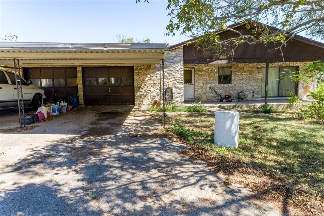 8701 Highway 290 Austin, TX 78737 - Photo 15 of 40 a view of a house with backyard porch and sitting area