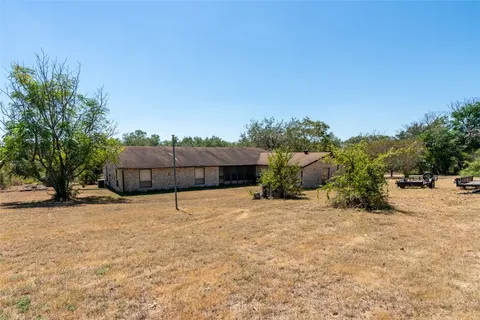 a terrace of a house with outdoor seating