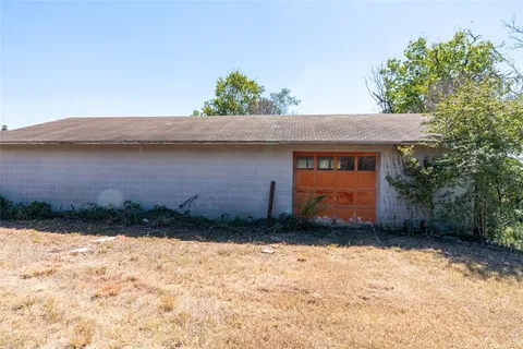 an aerial view of residential house with outdoor space and lake view