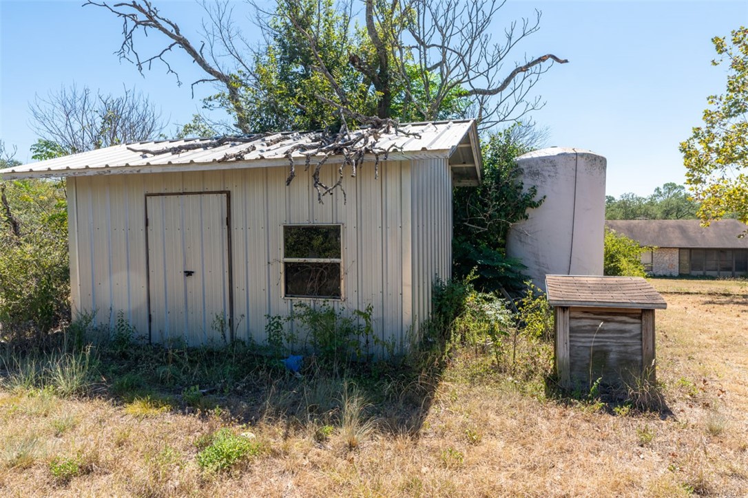 8701 Highway 290 Austin, TX 78737 - Photo 25 of 40 a backyard of a house with plants and outdoor seating