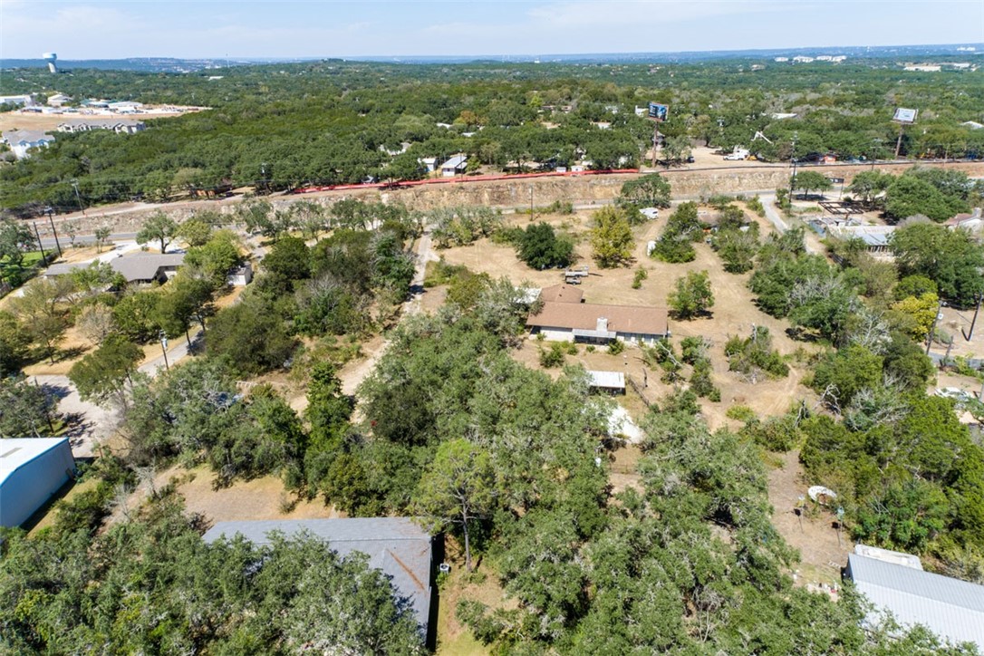 8701 Highway 290 Austin, TX 78737 - Photo 27 of 40 an aerial view of residential houses with outdoor space and trees