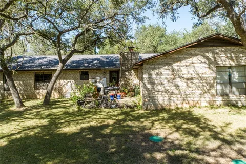 a view of a chair and table in the patio