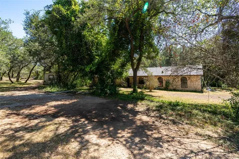a view of backyard with green space