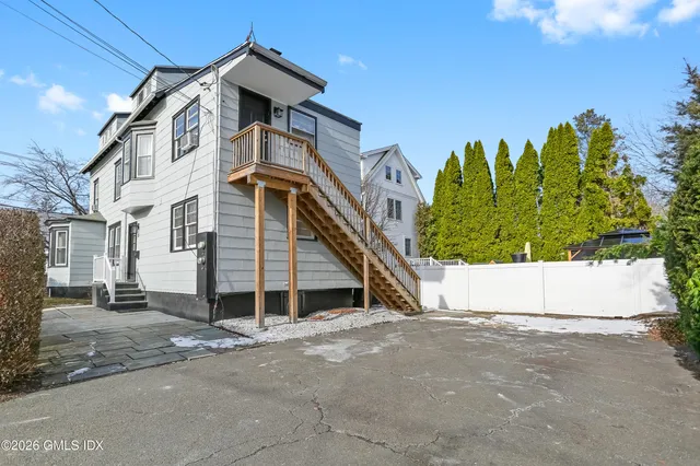a view of a house with a street