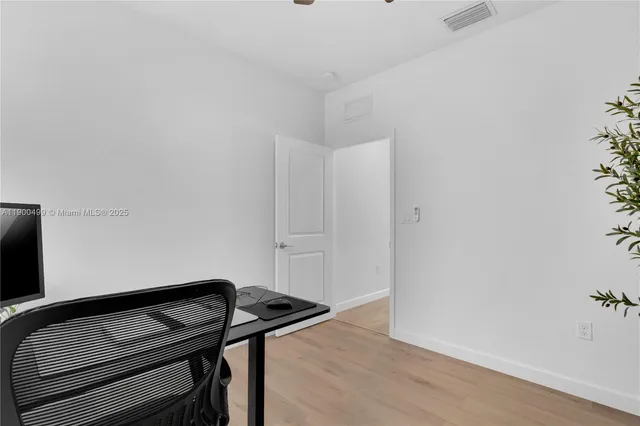 a view of a livingroom with wooden floor
