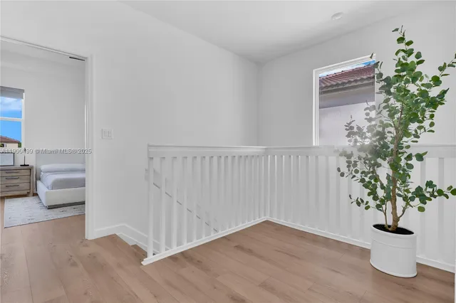 a view of entryway with wooden floor