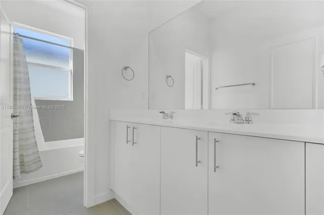 a view of a backyard with a tree