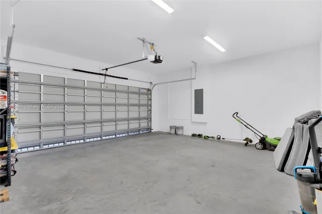 a view of a house with brick walls and a yard with a large tree