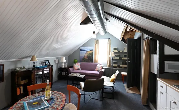 a bathroom with a toilet a sink and a mirror