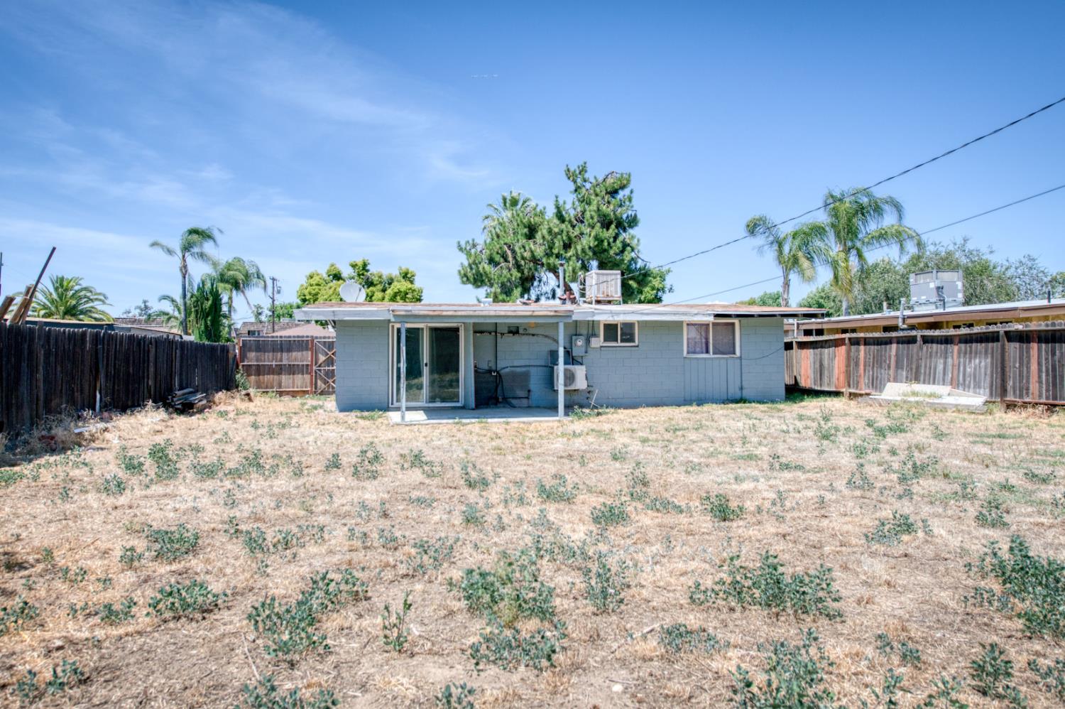 2326 East Hampton Way Fresno, CA 93726 - Photo 19 of 22 a view of a house with a yard and plants