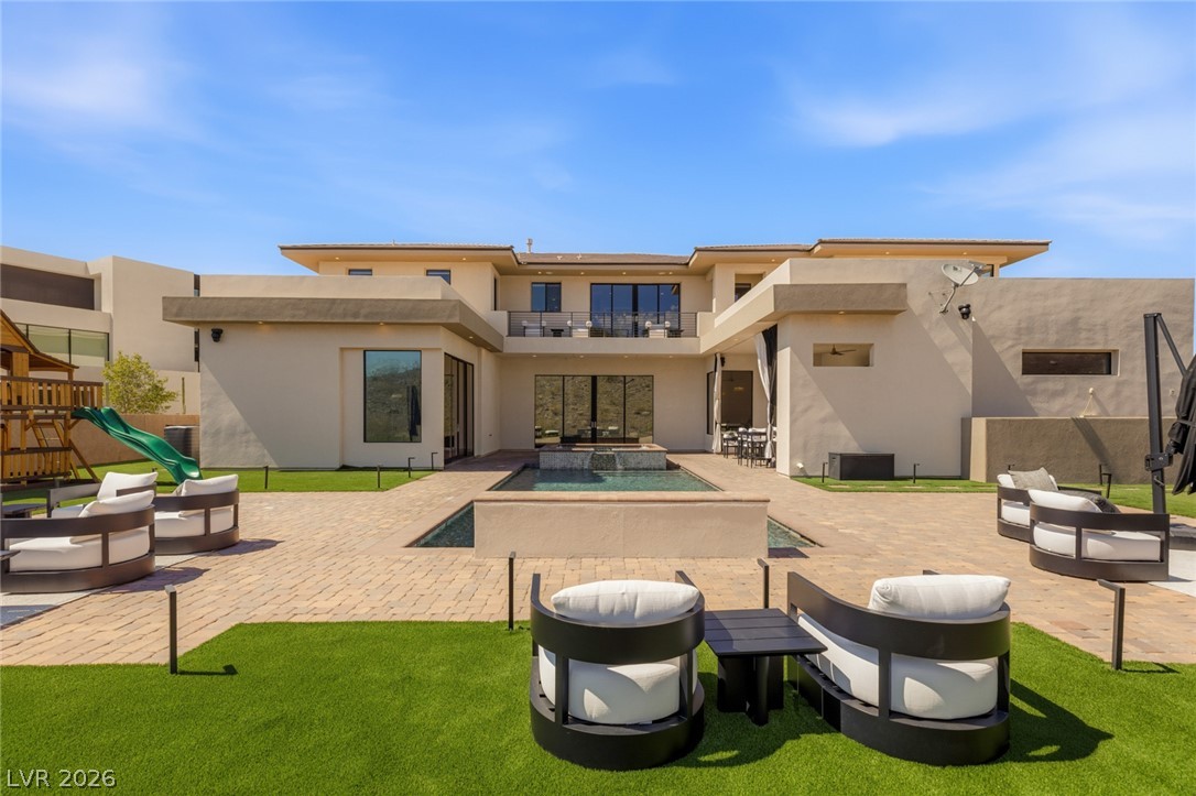 5 Crystal Tree Pass Henderson, NV 89052 - Photo 43 of 67 An inviting backyard with a tranquil pool and ample space for outdoor enjoyment.