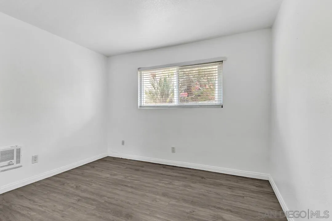 9860 Dale Avenue, Unit A12 Spring Valley, CA 91977 - Photo 18 of 28 wooden floor in an empty room with a window