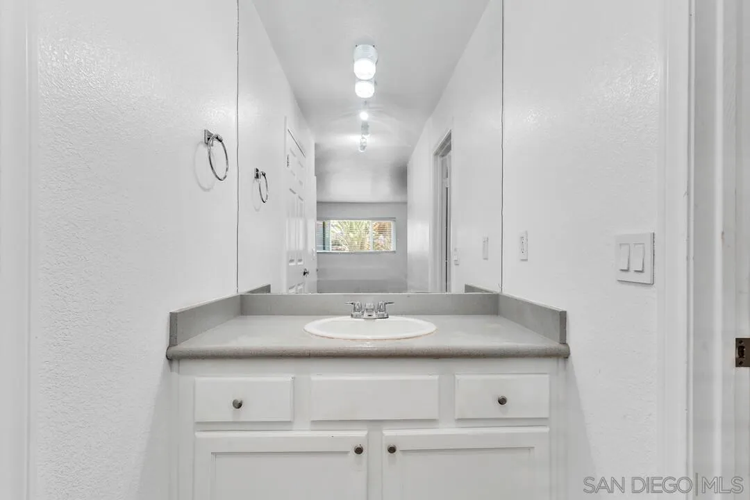9860 Dale Avenue, Unit A12 Spring Valley, CA 91977 - Photo 19 of 28 a bathroom with a sink and a mirror