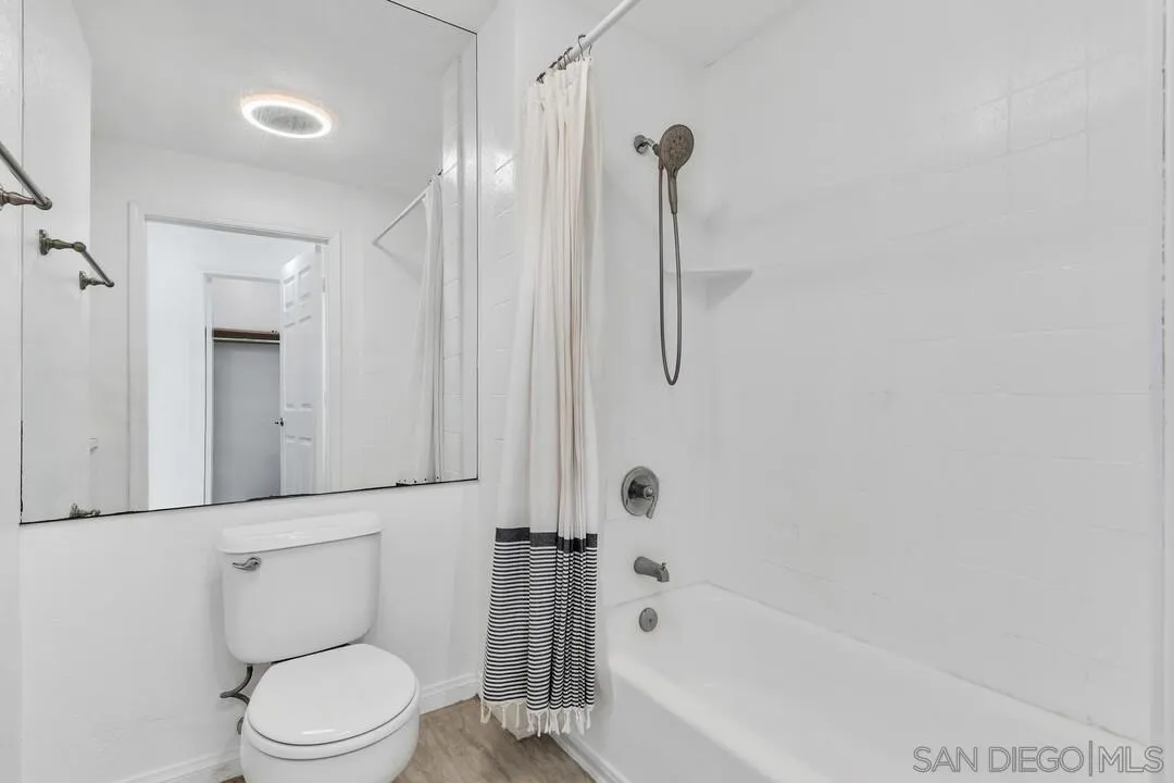 9860 Dale Avenue, Unit A12 Spring Valley, CA 91977 - Photo 21 of 28 a bathroom with a toilet and a shower