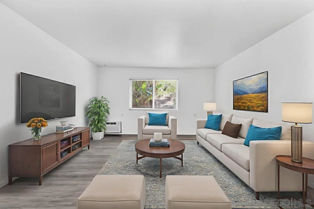 9860 Dale Avenue, Unit A12 Spring Valley, CA 91977 - Photo 7 of 28 a living room with furniture and a flat screen tv