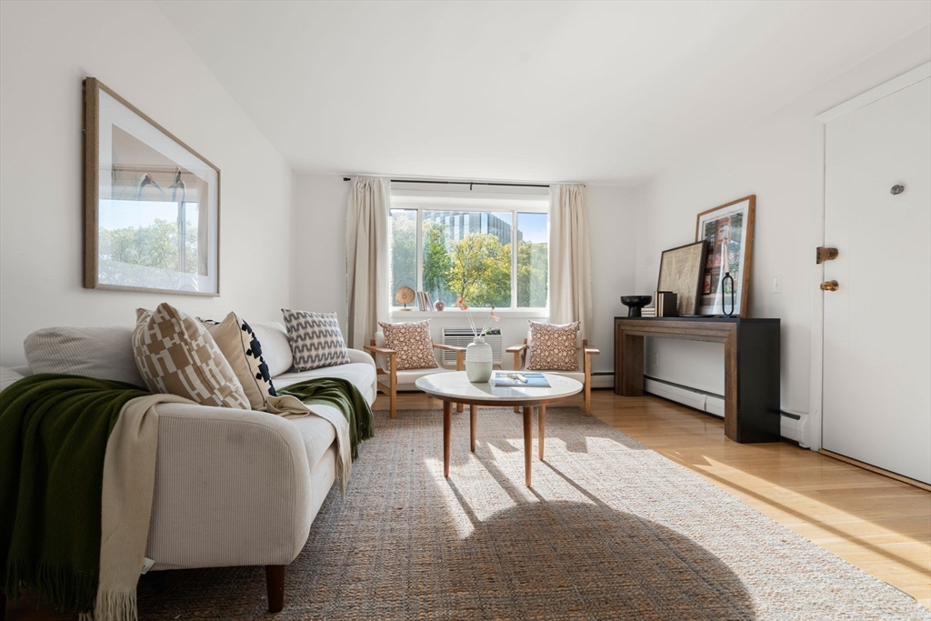 205 Kent Street, Unit 48 Brookline, MA 02446 - Photo 5 of 10 a living room with furniture and a window