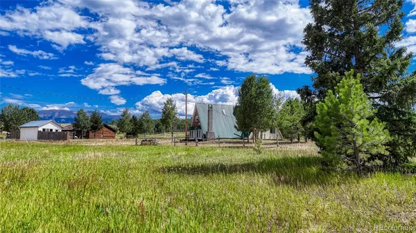 a view of a lake with a yard