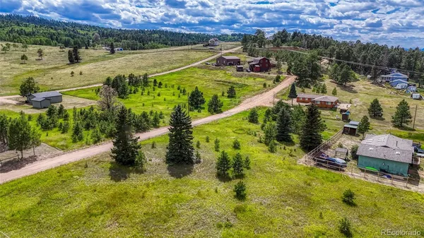 a view of a swimming pool with a yard