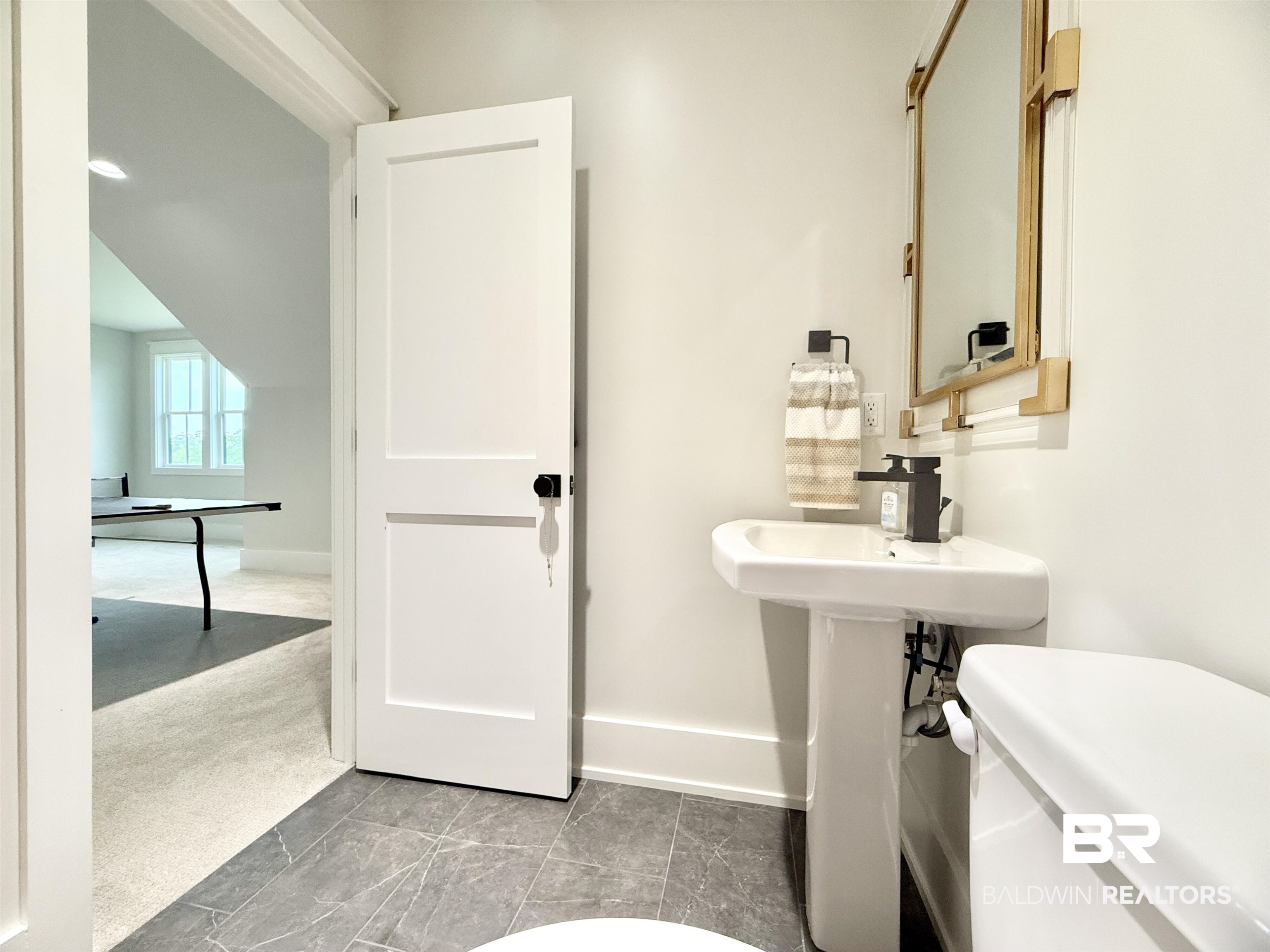21767 Gallery Boulevard Fairhope, AL 36532 - Photo 52 of 74 Half bath with toilet and baseboards