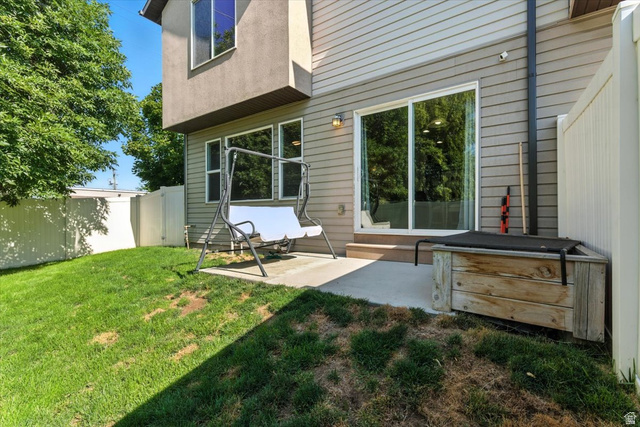 1187 Seraphim Court Layton, UT 84041 - Photo 17 of 18 Back of property with a patio area