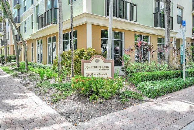 a view of a building with potted plants