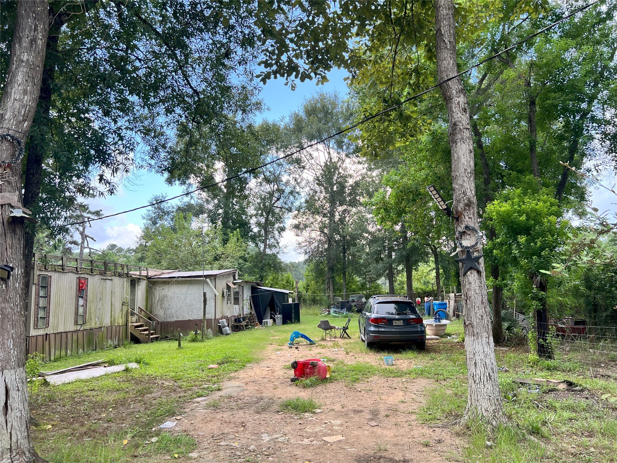 a white house that has a tree in front of it