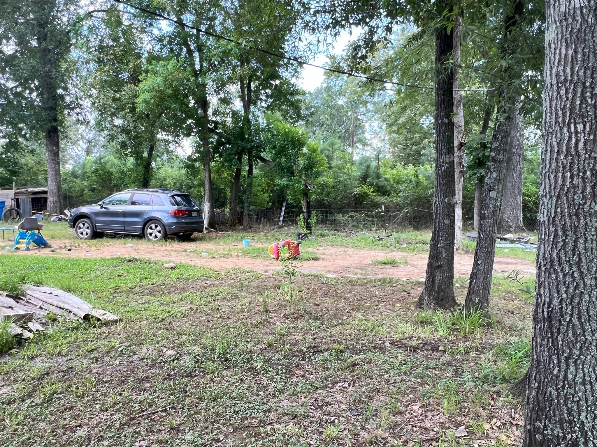 13156 12th Street Splendora, TX 77372 - Photo 5 of 5 a view of outdoor space with deck and trees